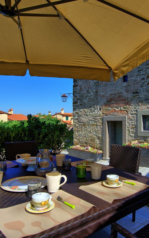 Casa La Fonte: Balkon / terras / patio, Tuin